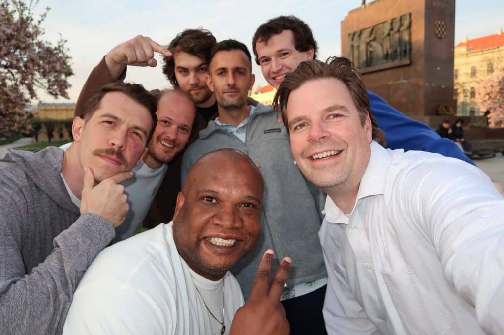 Gregory Bishop poses alongside his peers for a selfie.